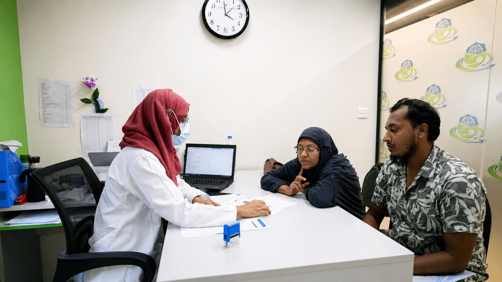 Doctor consulting with patients at Health Revolution Limited in Bangladesh